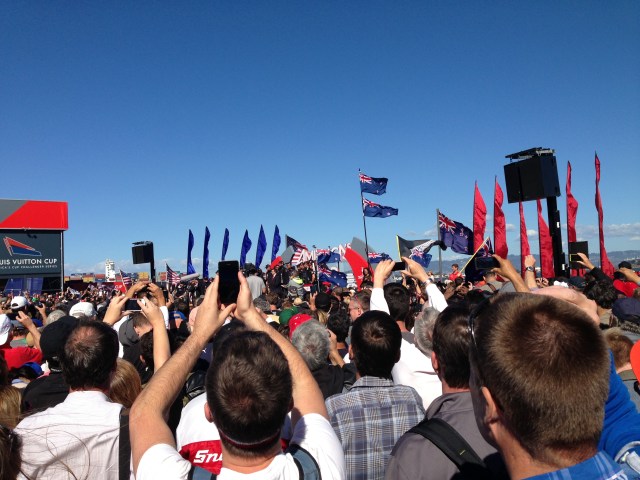 Hands raised as Oracle team is presented the Cup