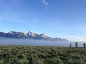 The Grand on a July morning, beyond a lifting fog, from a vehicle about 8 miles away heading south to the airport.