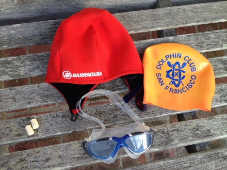 Neoprene Barracuda cap, silicon cap, goggles, & ear plugs.